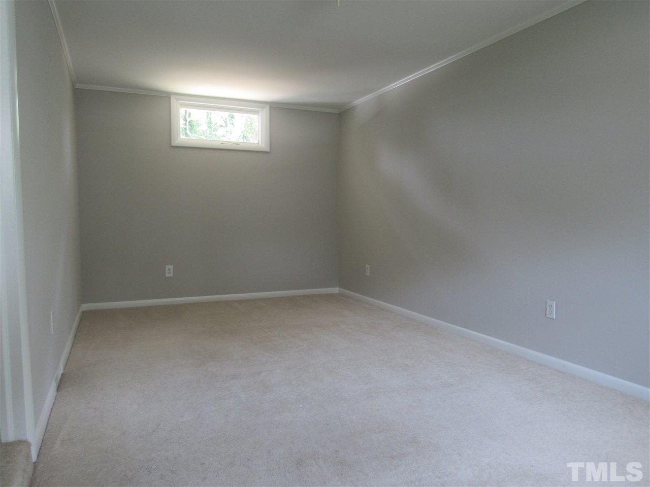 321 Quail Drive Raleigh, NC 27604 - Photo 16 of 25 a view of an empty room and a window