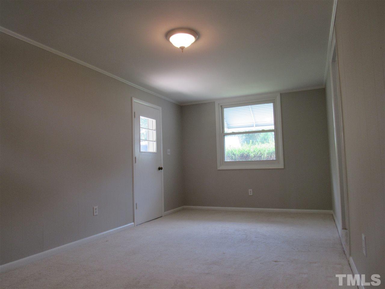 321 Quail Drive Raleigh, NC 27604 - Photo 17 of 25 an empty room with windows and closet