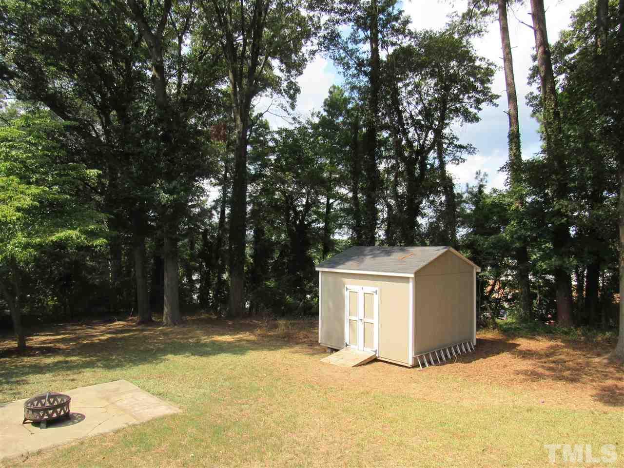 321 Quail Drive Raleigh, NC 27604 - Photo 22 of 25 a view of a white house with a large trees