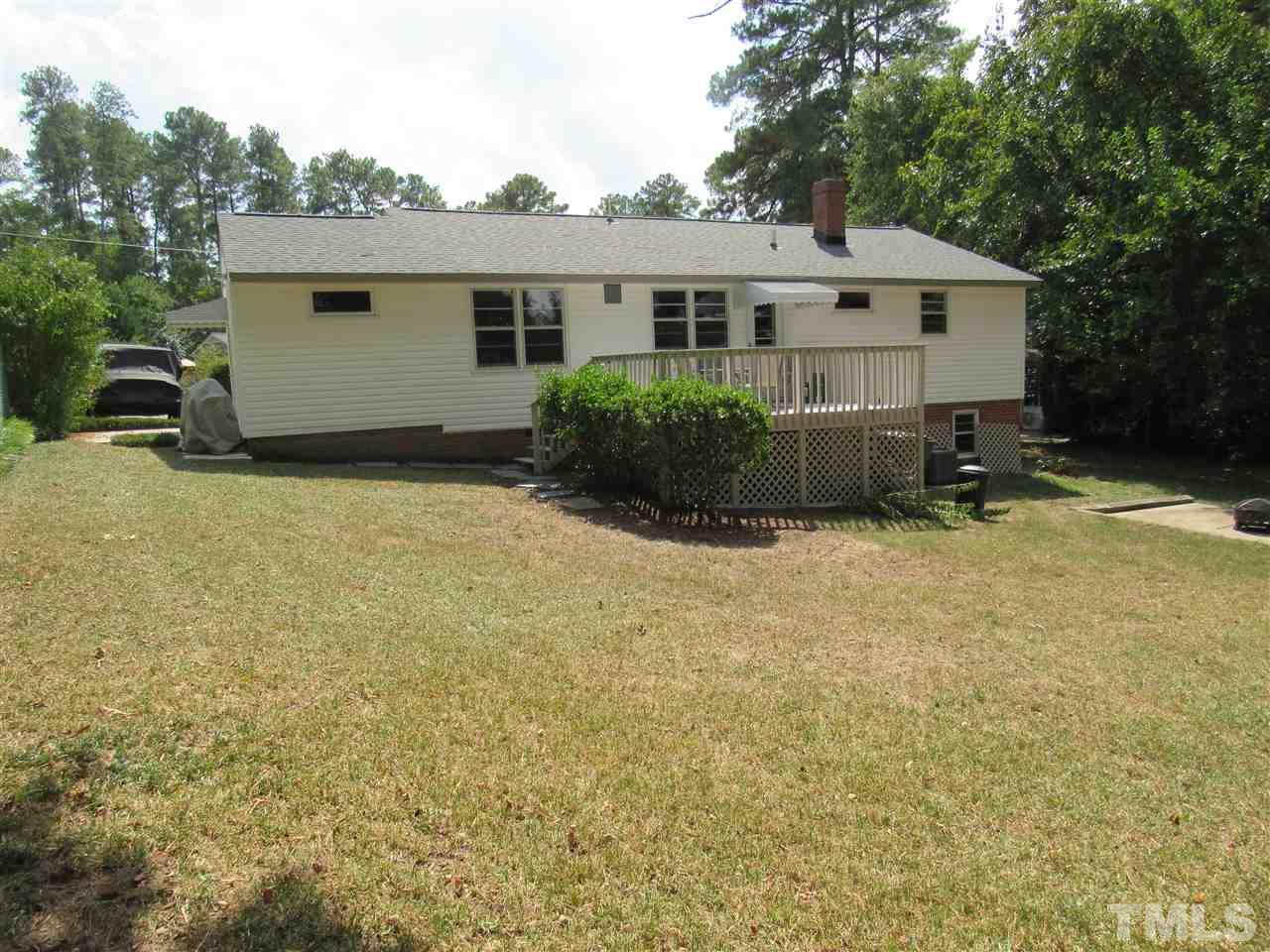 321 Quail Drive Raleigh, NC 27604 - Photo 23 of 25 a view of a house with backyard and sitting area