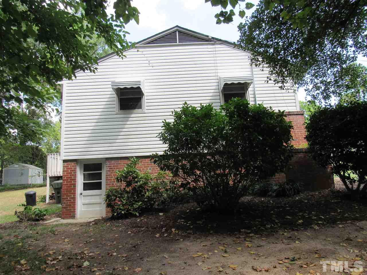 321 Quail Drive Raleigh, NC 27604 - Photo 25 of 25 a view of a house with a yard and garage