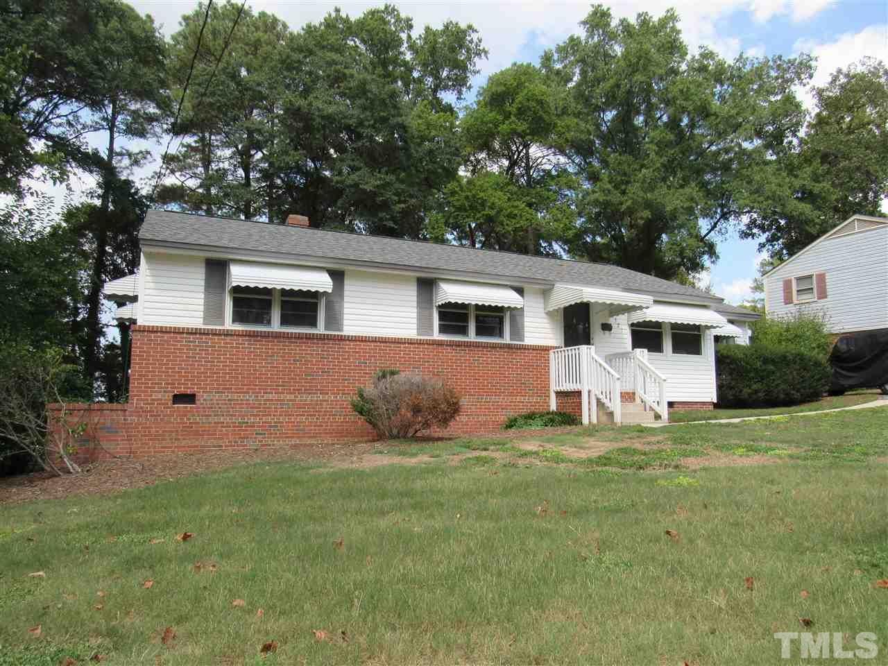 321 Quail Drive Raleigh, NC 27604 - Photo 3 of 25 a front view of house with yard and trees around