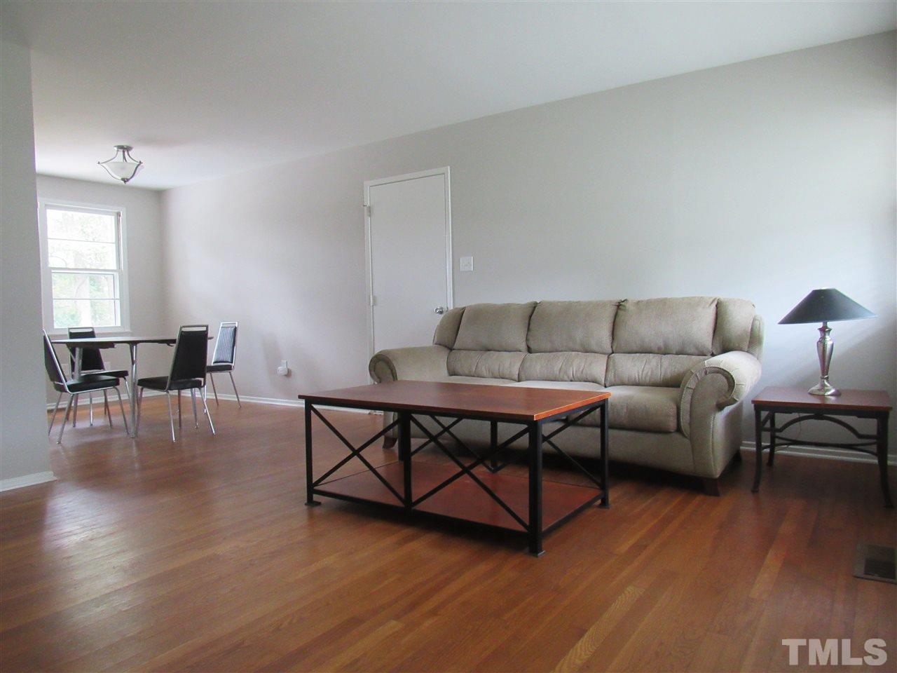 321 Quail Drive Raleigh, NC 27604 - Photo 4 of 25 a living room with furniture and wooden floor