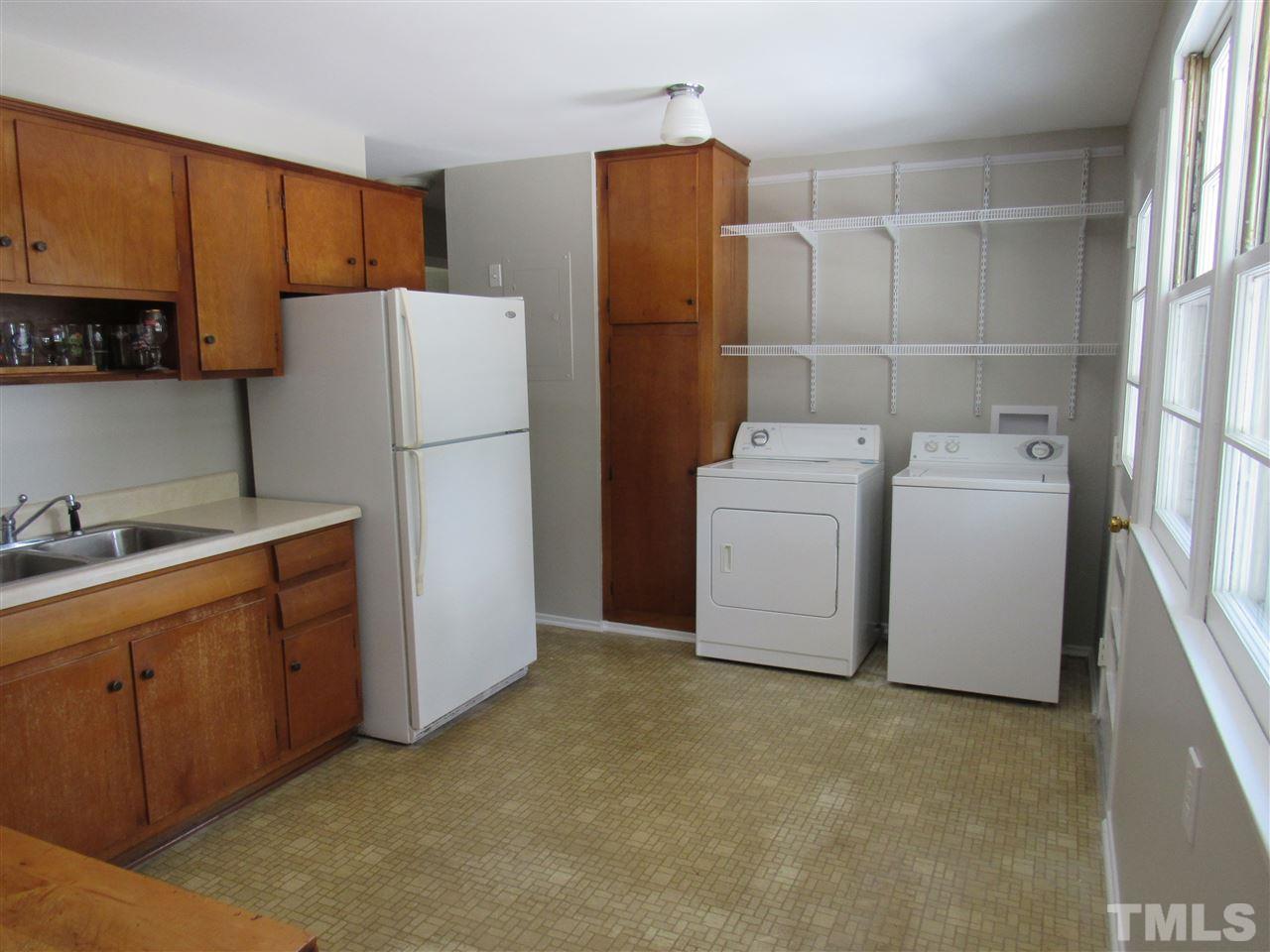 321 Quail Drive Raleigh, NC 27604 - Photo 7 of 25 a utility room with dryer and washer