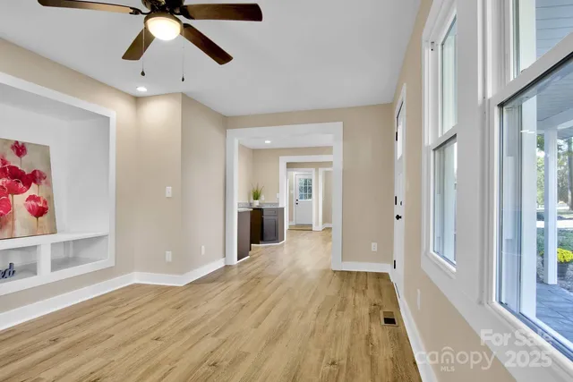a view of an entryway with wooden floor