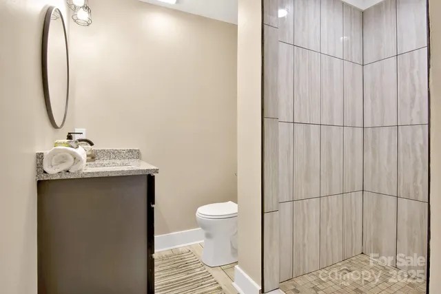 a view of a house with a big yard and large trees