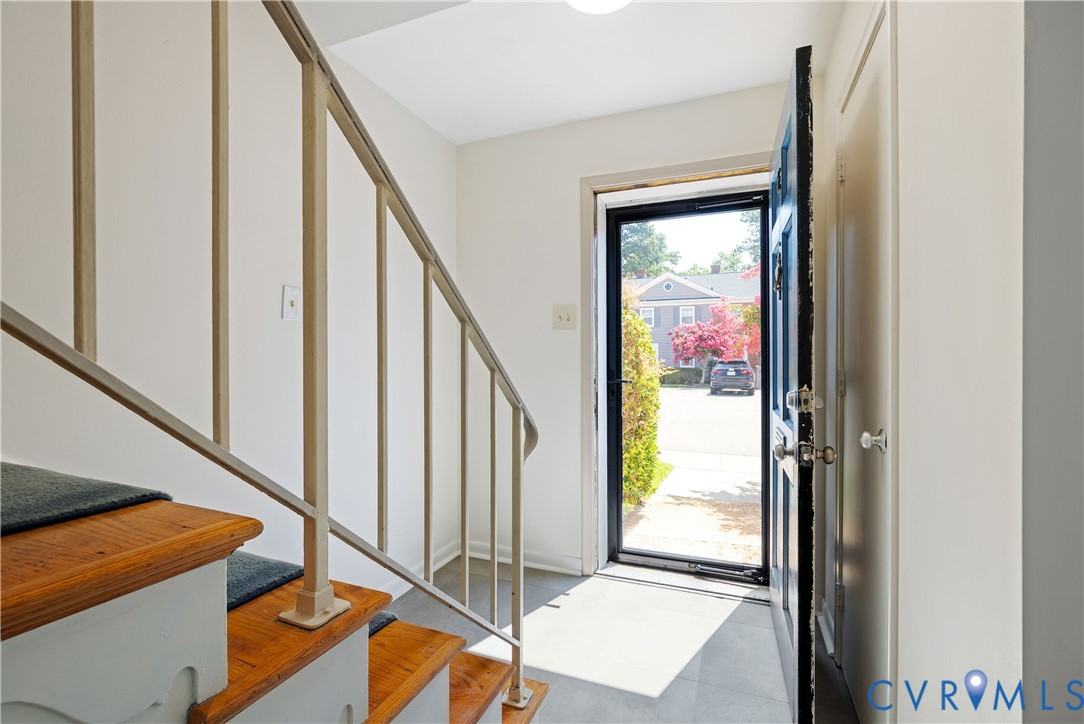 9129 Derbyshire Road, Unit E Henrico, VA 23229 - Photo 7 of 36 Foyer featuring a hardwood staircase with carpet t