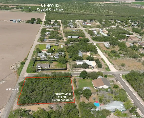 an aerial view of residential houses with city view