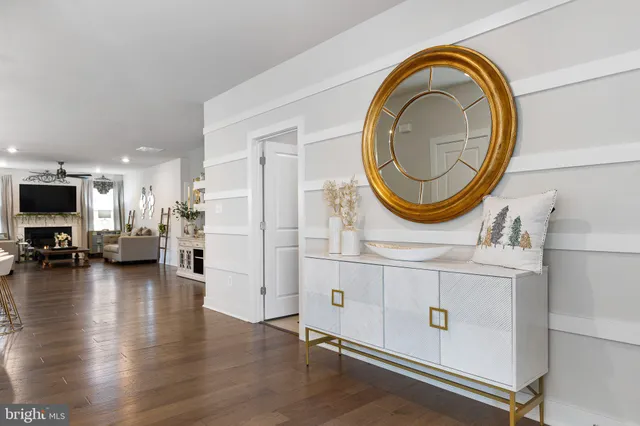 a view of a living room and kitchen with furniture
