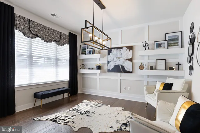 a living room with furniture and a rug
