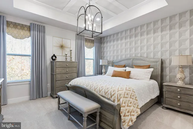 a bedroom with a bed dresser and a window