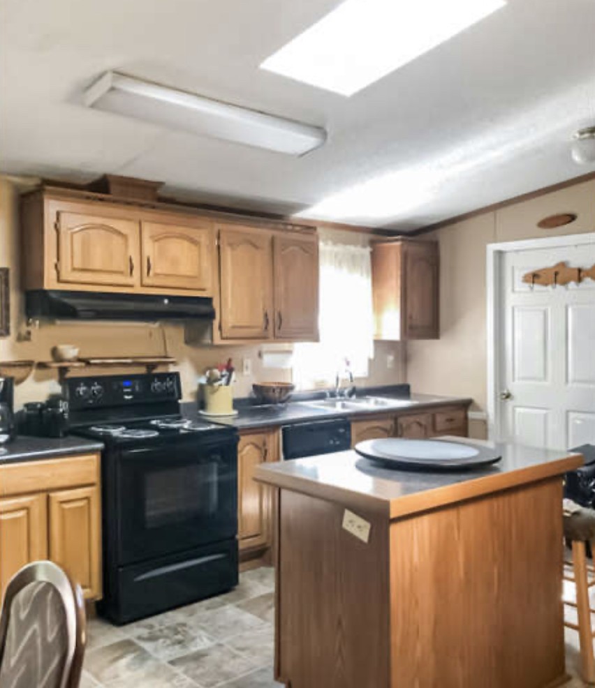 121 Red Top Road Indian Mound, TN 37079 - Photo 7 of 19 a kitchen with granite countertop a sink stove and cabinets
