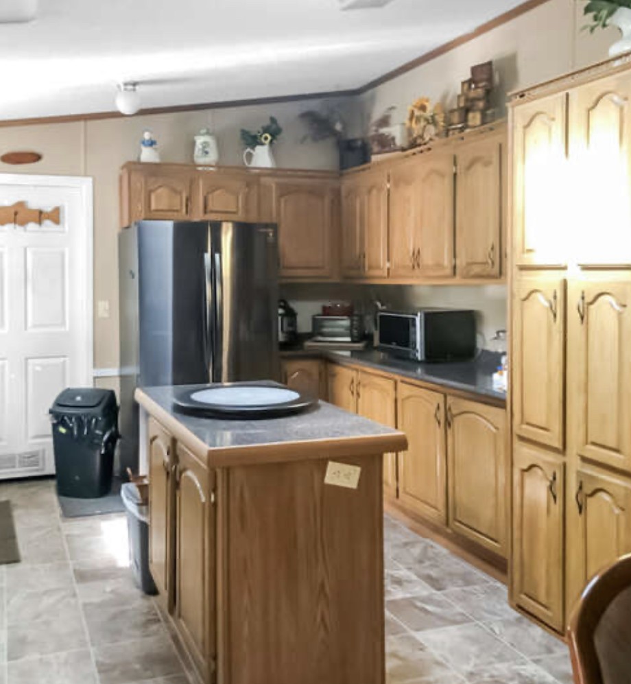 121 Red Top Road Indian Mound, TN 37079 - Photo 9 of 19 a kitchen with stainless steel appliances granite countertop a refrigerator a stove and a sink