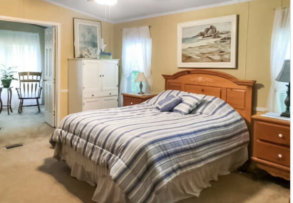 121 Red Top Road Indian Mound, TN 37079 - Photo 10 of 19 a bedroom with a bed and a painting on the wall