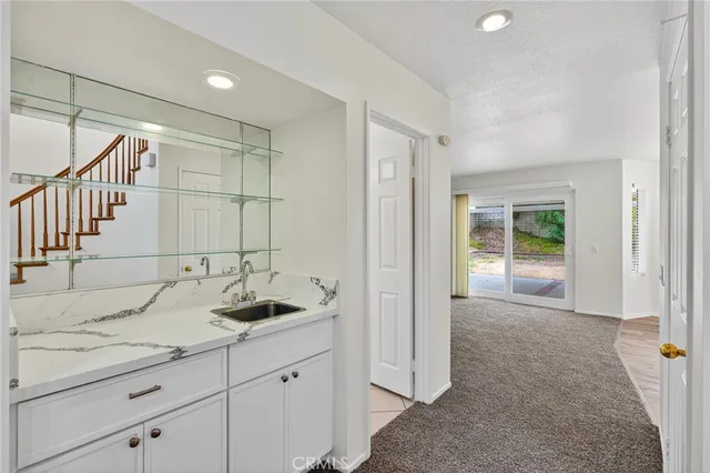 a bathroom with a sink and mirror