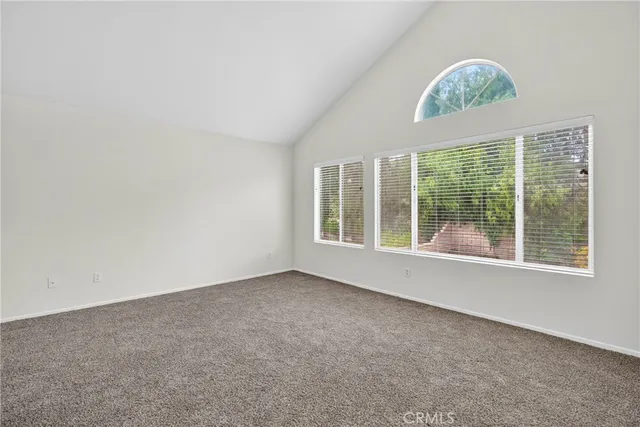 a bathroom with a granite countertop sink a mirror and a bathtub