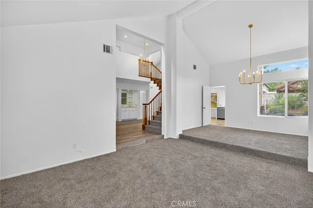 a view of a room with stairs and windows