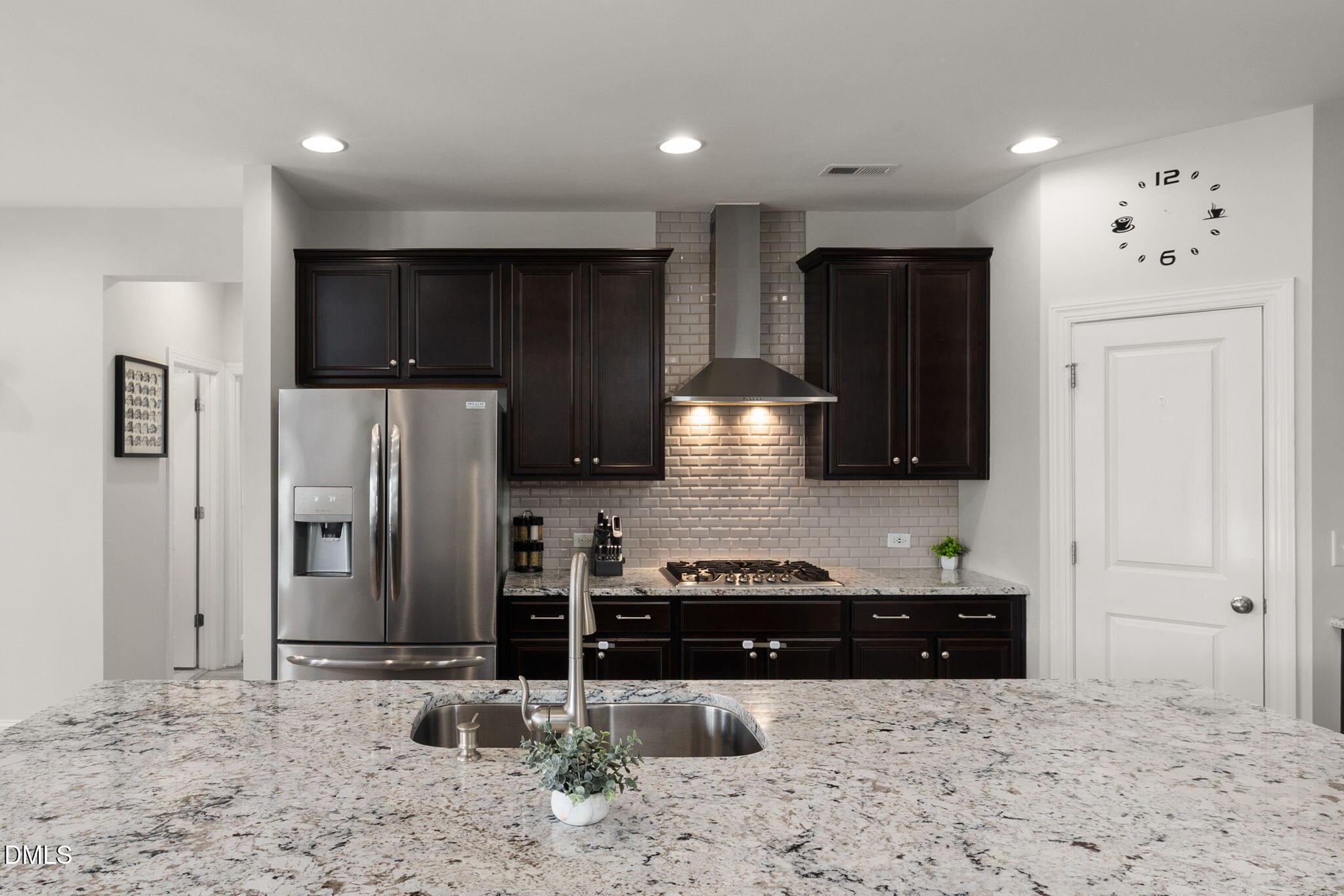 3422 Longleaf Estates Drive Raleigh, NC 27616 - Photo 22 of 71 a kitchen with stainless steel appliances a refrigerator sink and cabinets