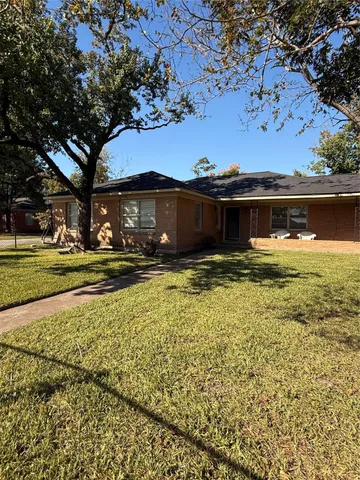 a view of swimming pool with outdoor seating and deck