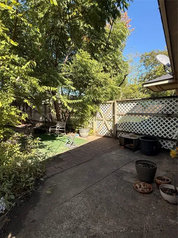 a view of a backyard with sitting area