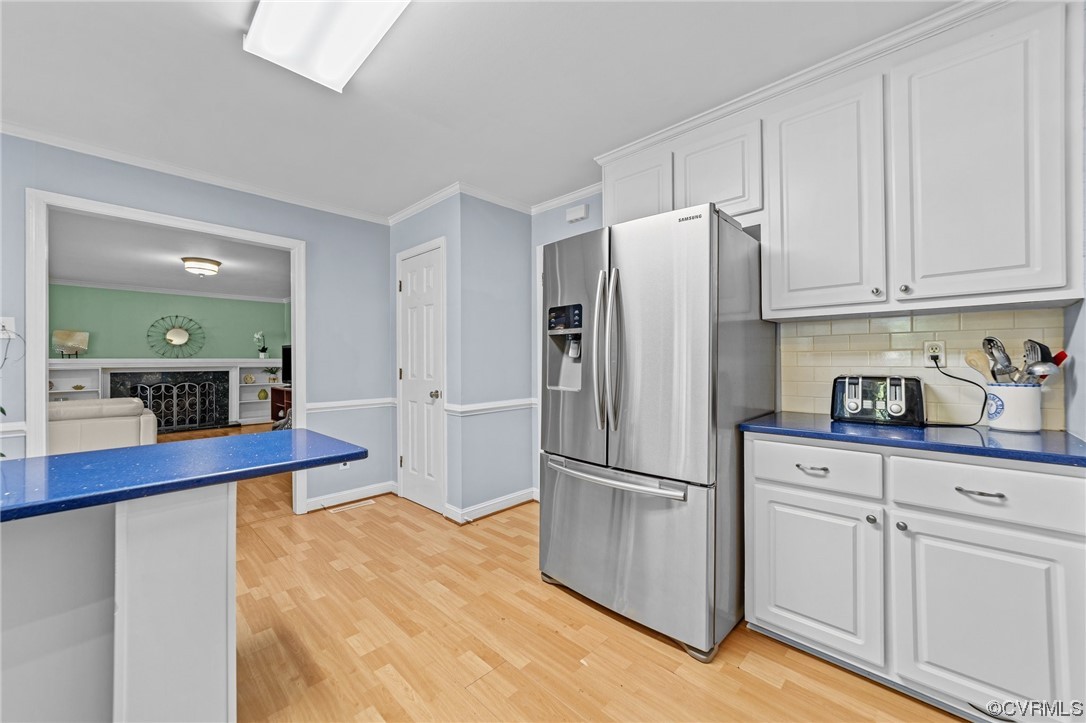 13206 Queensgate Road Midlothian, VA 23114 - Photo 12 of 42 a kitchen with stainless steel appliances a refrigerator and cabinets