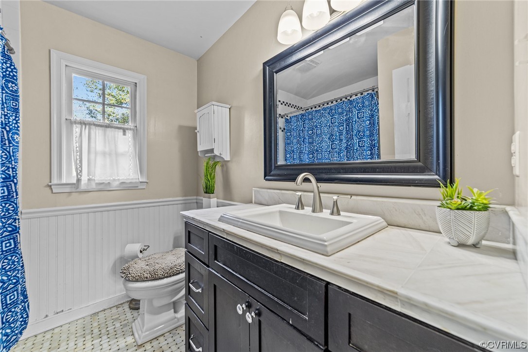 13206 Queensgate Road Midlothian, VA 23114 - Photo 23 of 42 a bathroom with a sink a toilet and a window