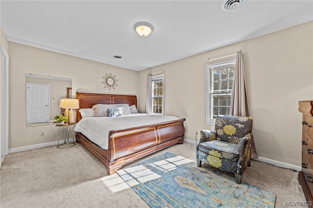13206 Queensgate Road Midlothian, VA 23114 - Photo 24 of 42 a bedroom with a bed and wooden floor