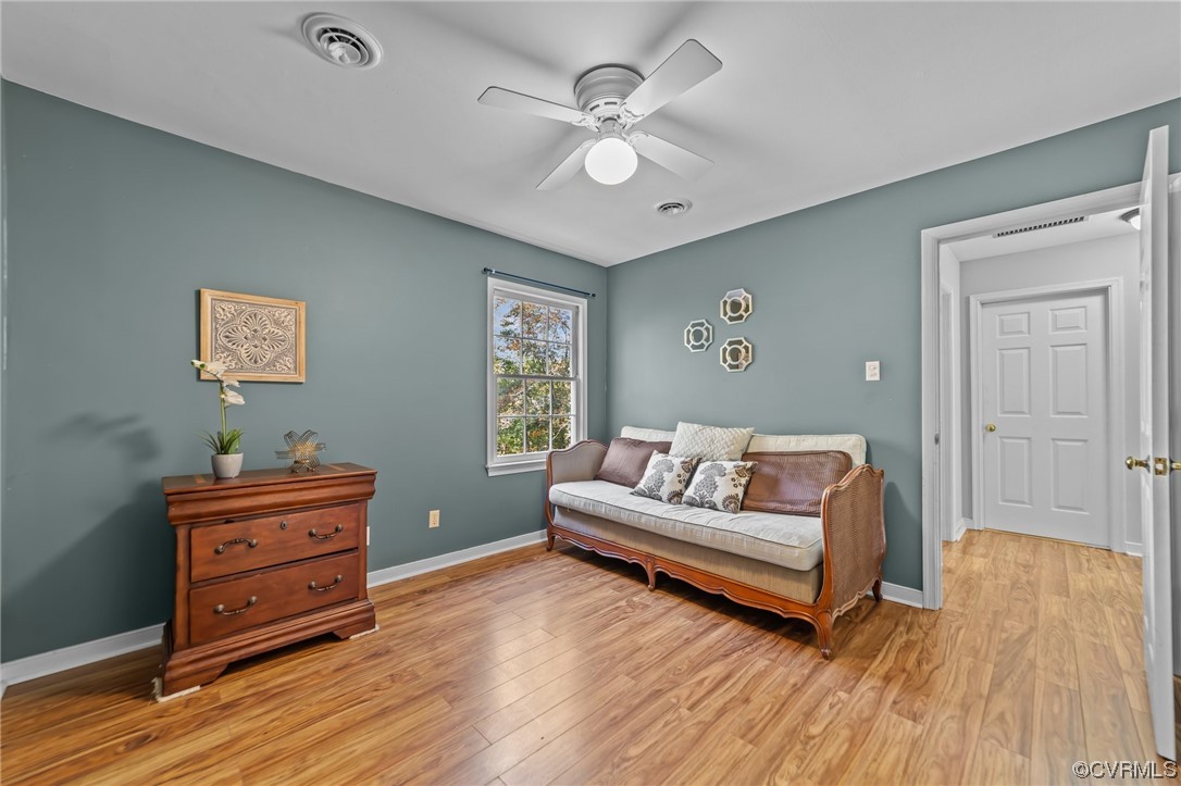13206 Queensgate Road Midlothian, VA 23114 - Photo 28 of 42 a living room with furniture and wooden floor