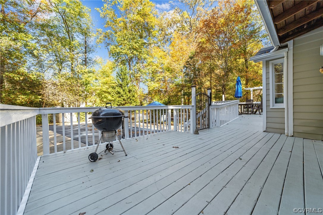13206 Queensgate Road Midlothian, VA 23114 - Photo 8 of 42 a view of a deck with wooden floor and outdoor seating