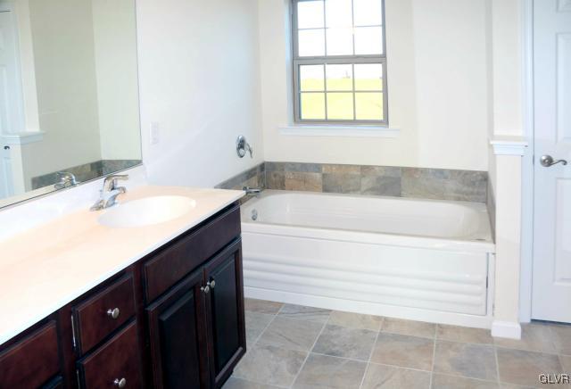 205 East Dell Road Bath, PA 18014 - Photo 9 of 14 a bathroom with a sink and a bathtub