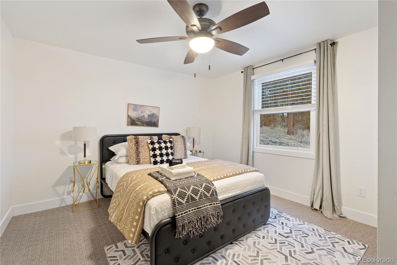 29 South Pine Drive Bailey, CO 80421 - Photo 16 of 27 a bedroom with a bed and a window