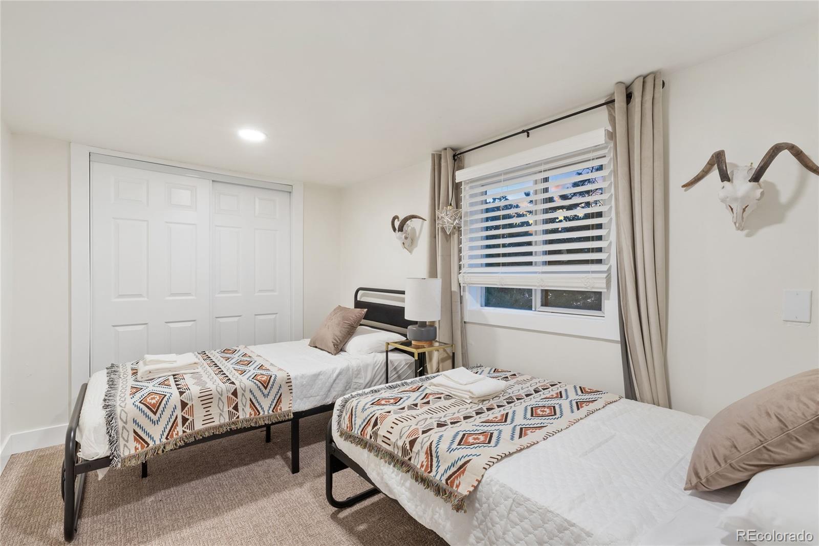 29 South Pine Drive Bailey, CO 80421 - Photo 23 of 27 a bedroom with two beds and a window