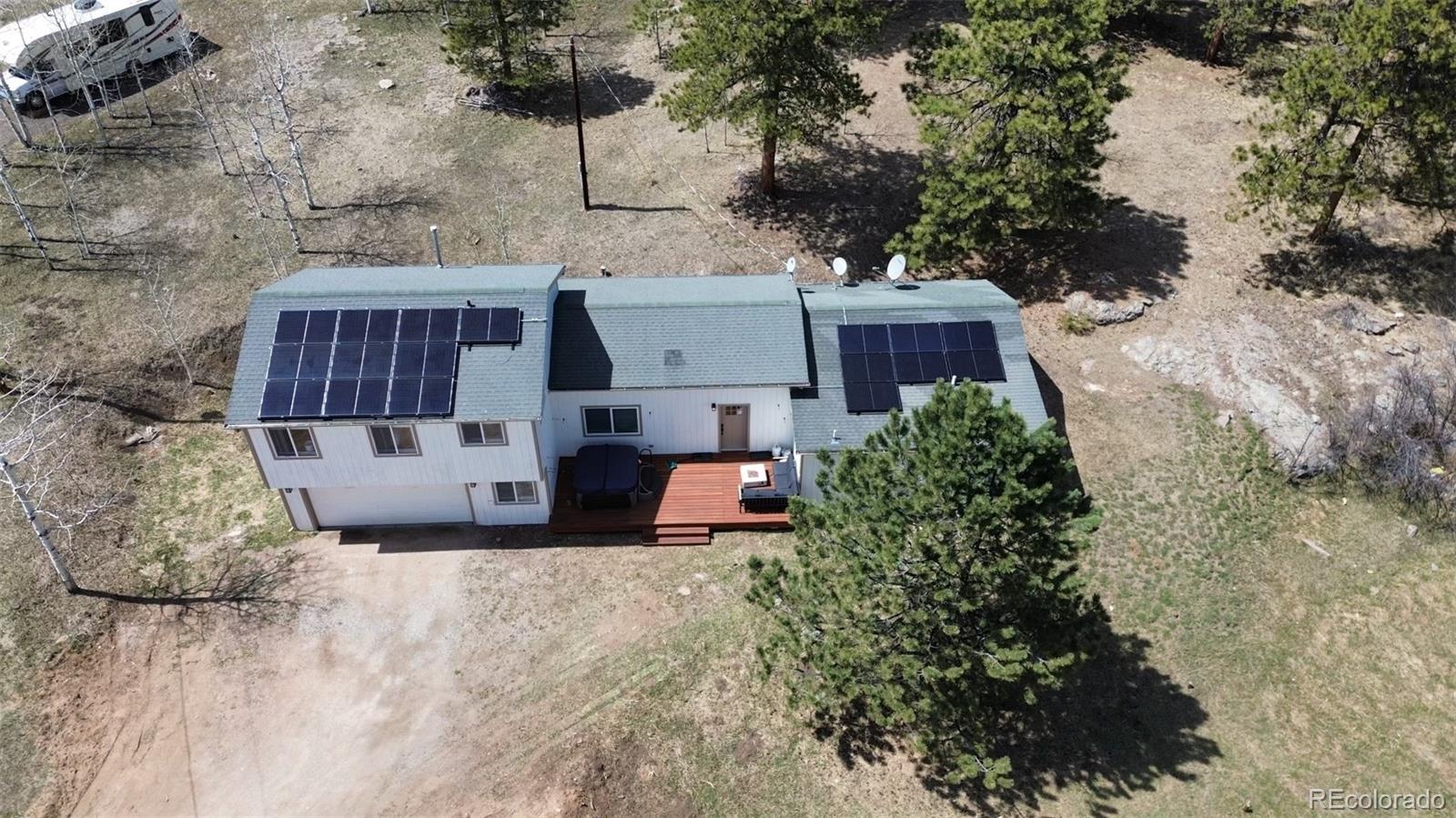 29 South Pine Drive Bailey, CO 80421 - Photo 27 of 27 an aerial view of a house with yard and large trees