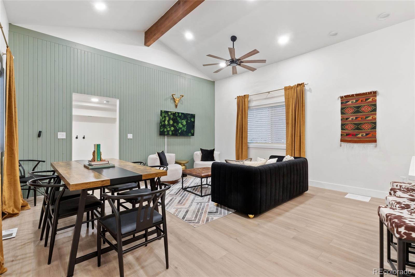 29 South Pine Drive Bailey, CO 80421 - Photo 5 of 27 a living room with furniture a window and a ceiling fan