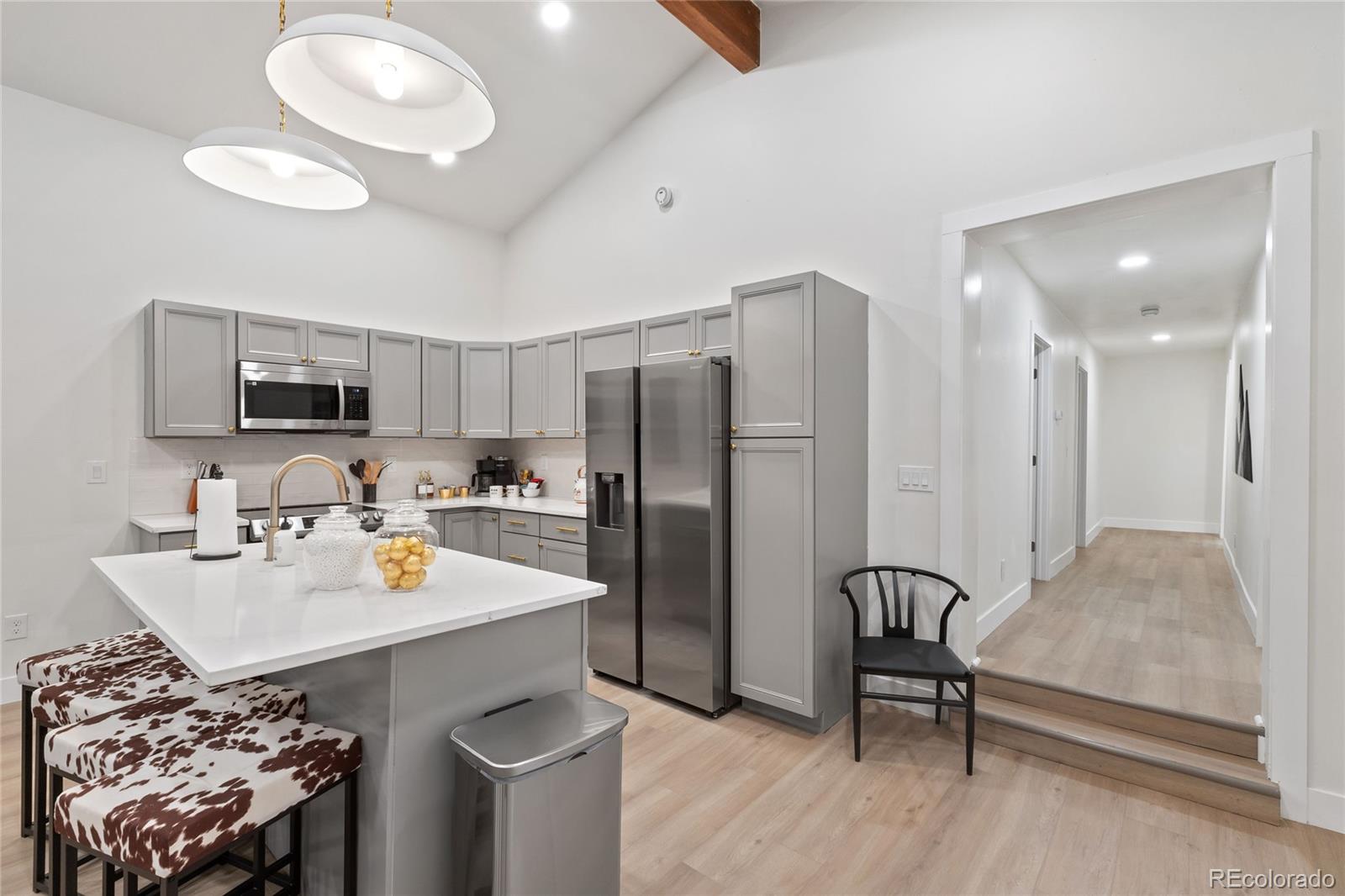 29 South Pine Drive Bailey, CO 80421 - Photo 7 of 27 a kitchen with stainless steel appliances granite countertop a sink a stove and a refrigerator