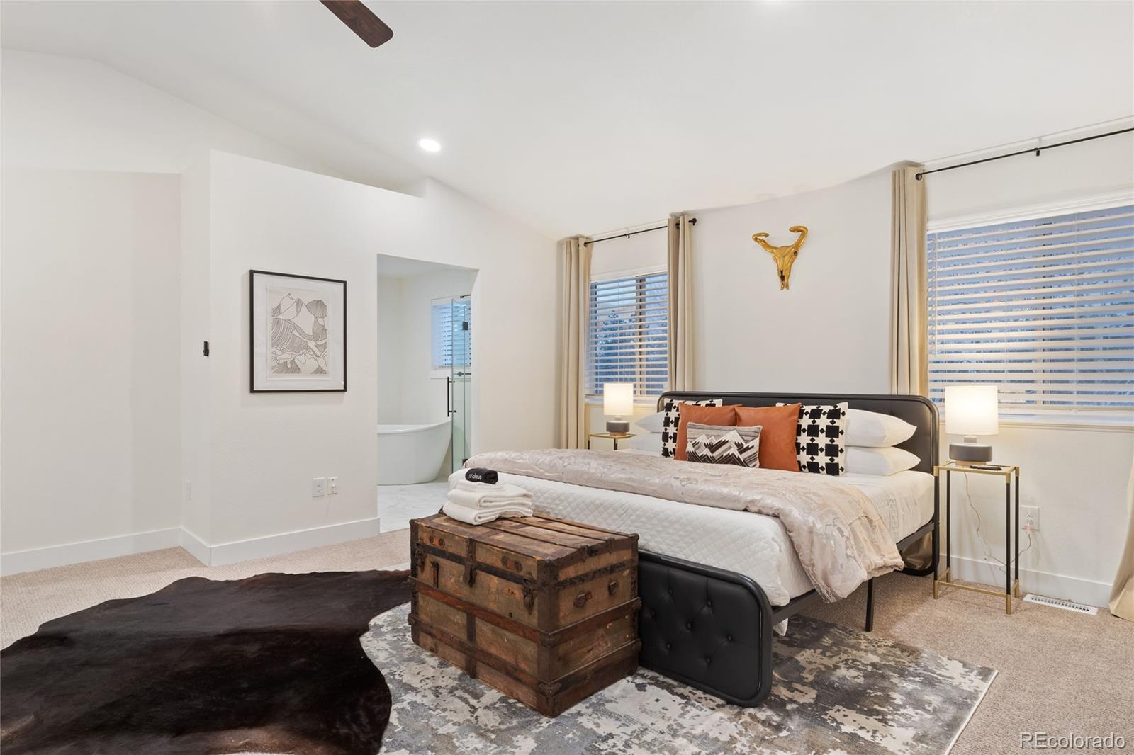 29 South Pine Drive Bailey, CO 80421 - Photo 10 of 27 a bedroom with a bed lamp and a window