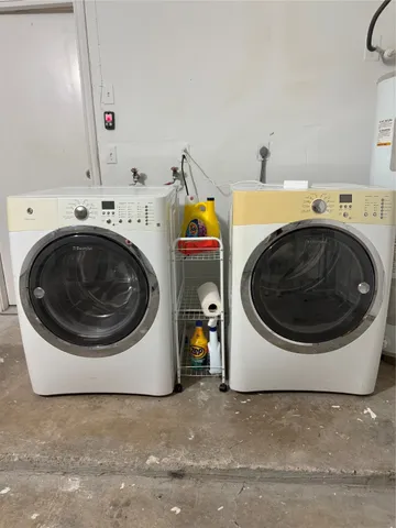 a utility room with dryer and washer