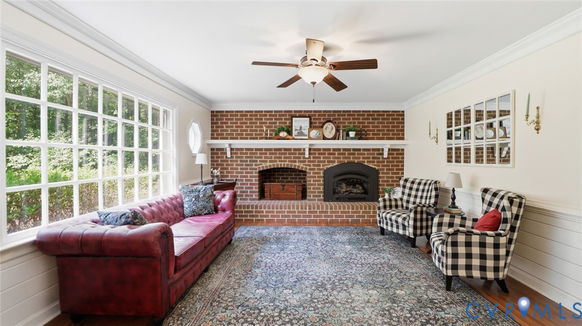 10716 Chalkley Road Richmond, VA 23237 - Photo 3 of 46 a living room with furniture and a fireplace