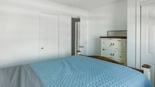 a view of an empty room and cabinet