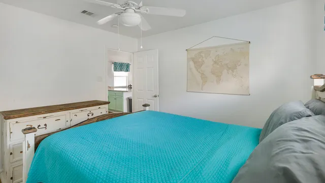 a view of room with window and ceiling fan