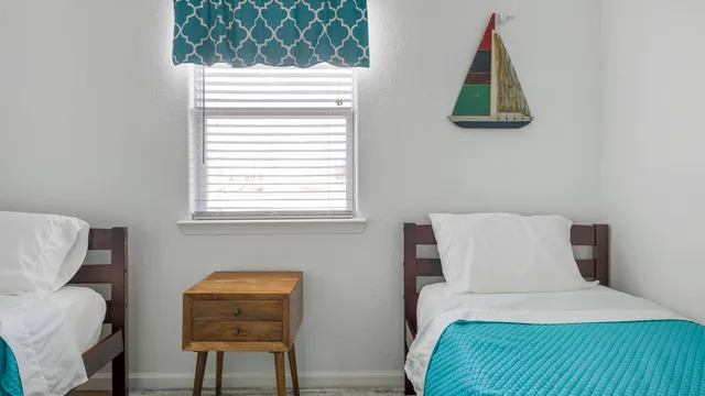 a bedroom with a bed and a chair