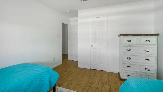 a bedroom with a bed and a closet