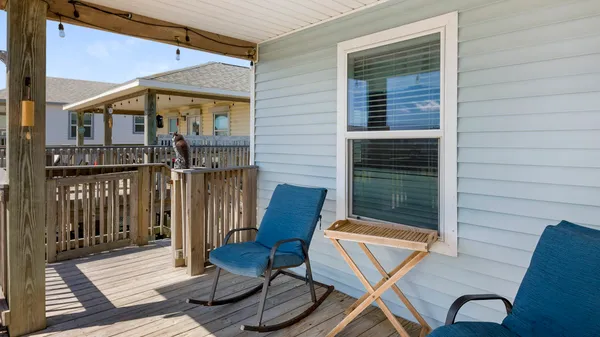 a view of a balcony with furniture