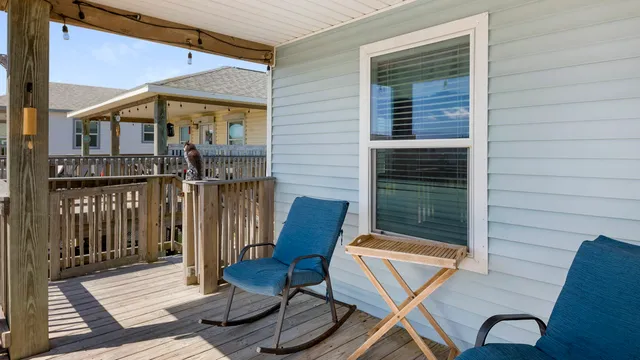 a view of a balcony with furniture
