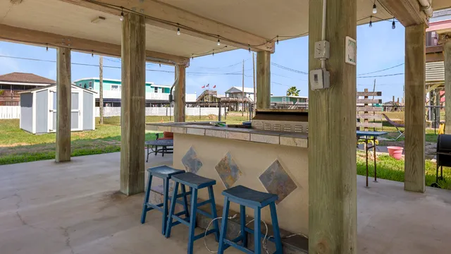 a view of a chairs and table in the patio