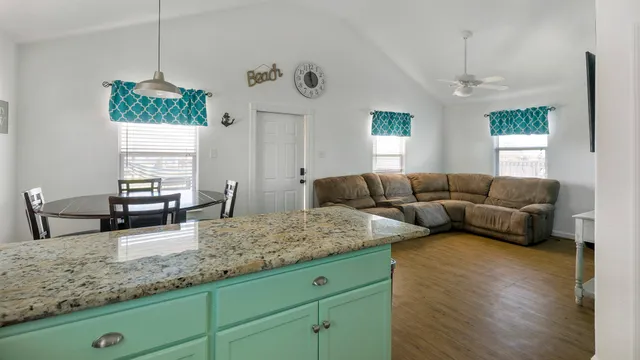 a living room with furniture window and wooden floor