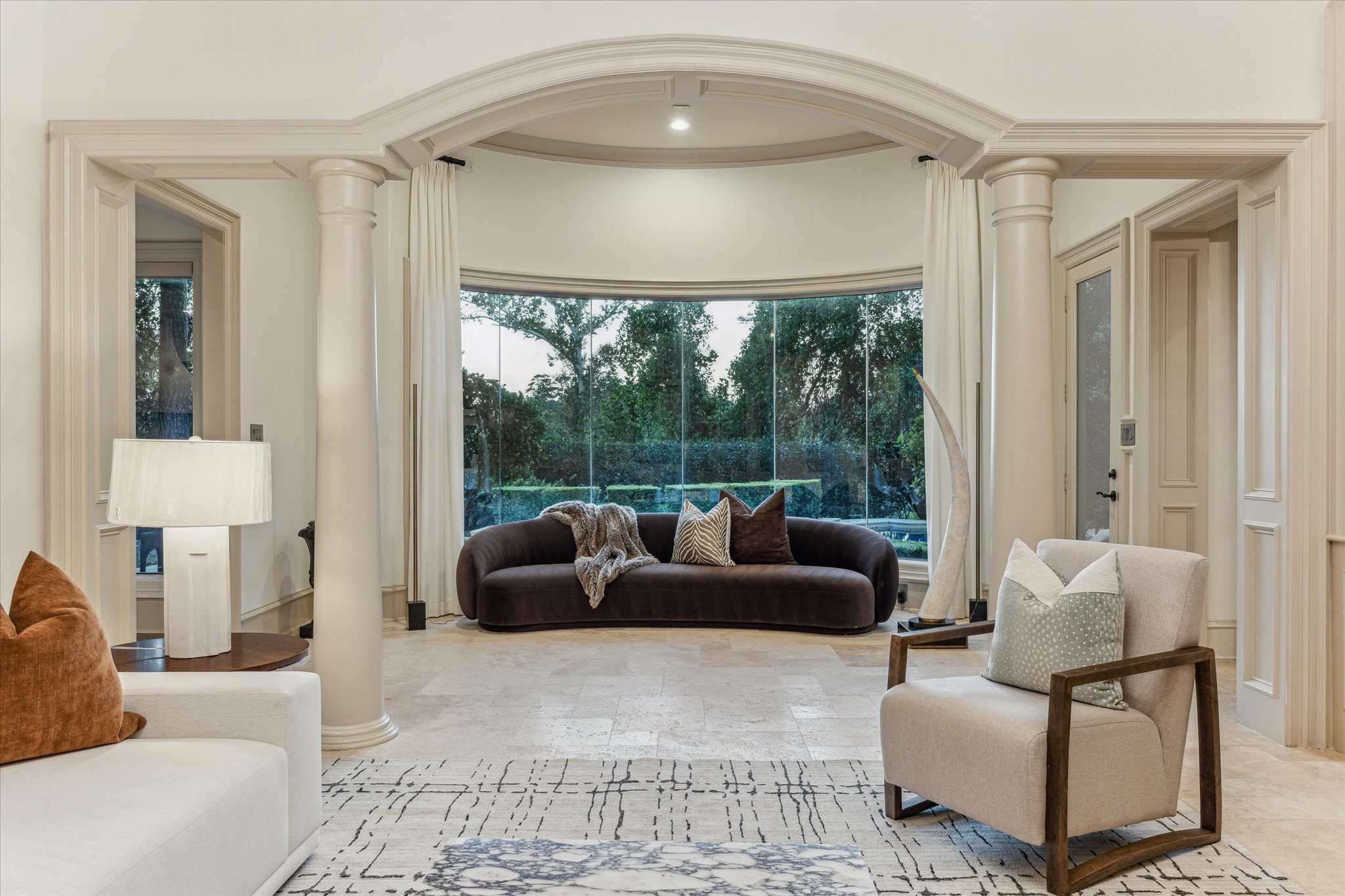 918 Huntington Cove Houston, TX 77063 - Photo 15 of 50 With a focus of the picturesque outdoor surroundings, this intimate secondary seating area is the perfect place to unwind offering a front-row seat of outdoor vistas.