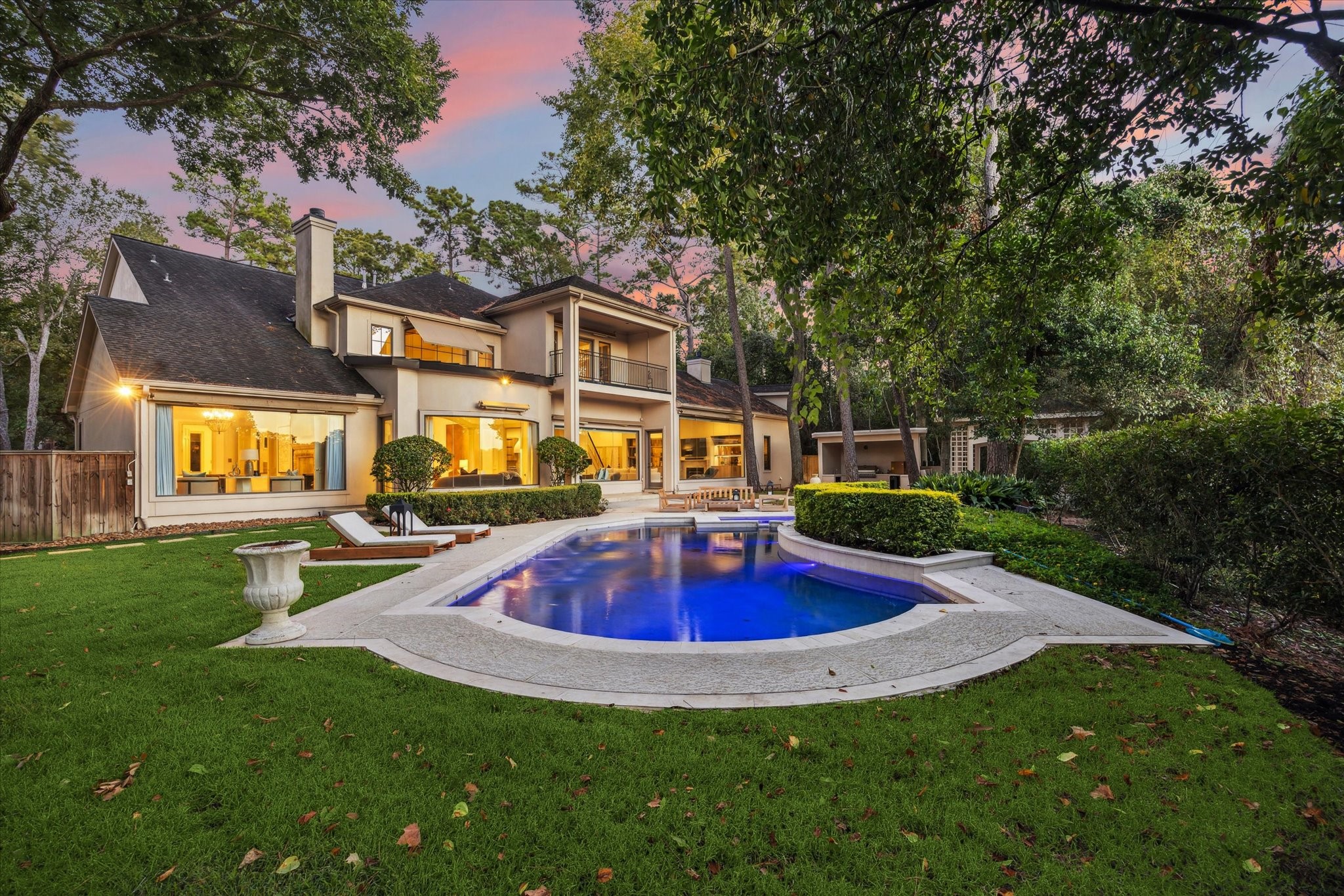 918 Huntington Cove Houston, TX 77063 - Photo 16 of 50 From the large formal living room windows, a stunning first introduction to your Private Oasis. Step outside to discover a sparkling pool with water-fall and magnificent grounds designed for true resort-style living experience.