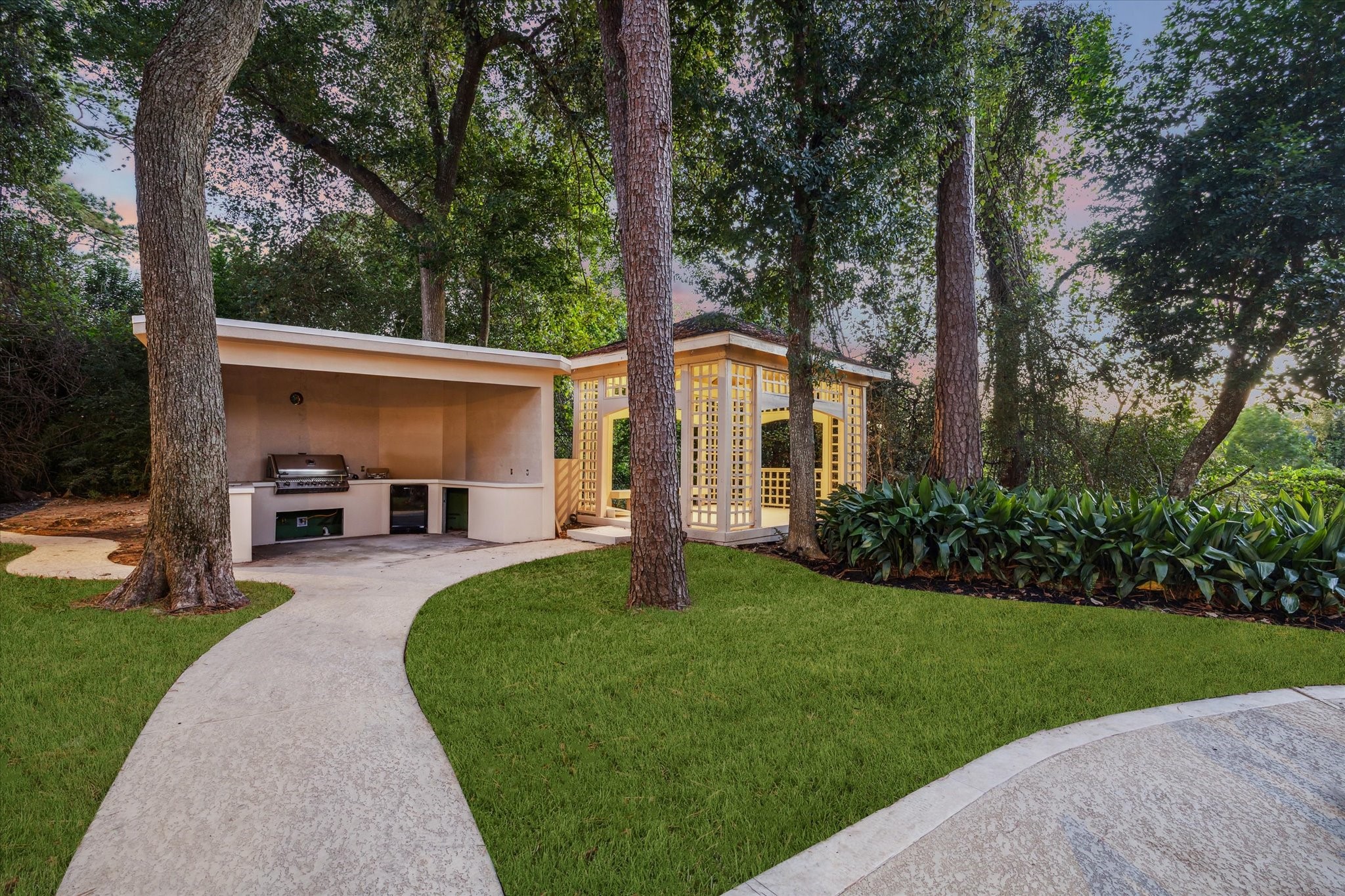 918 Huntington Cove Houston, TX 77063 - Photo 19 of 50 The backyard is enhanced with the outdoor kitchen and a gazebo creating the perfect spot for sunset views.