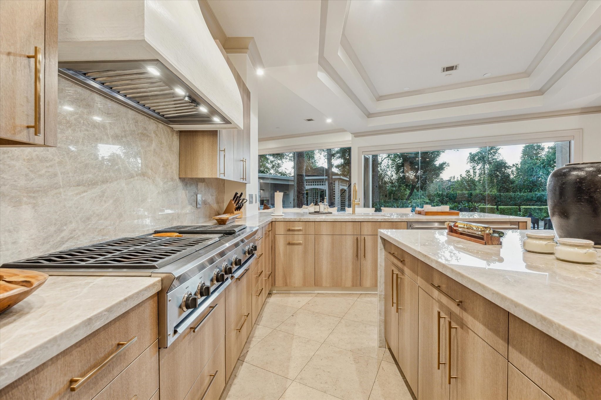 918 Huntington Cove Houston, TX 77063 - Photo 30 of 50 A functional and adaptable kitchen with stainless steel appliances conveniently flows into the multi-purpose breakfast bar.